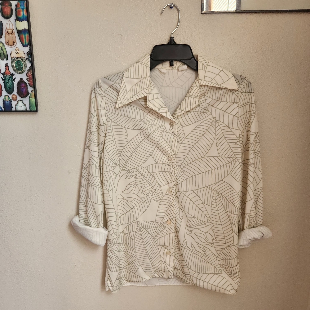 White and green, floral blouse